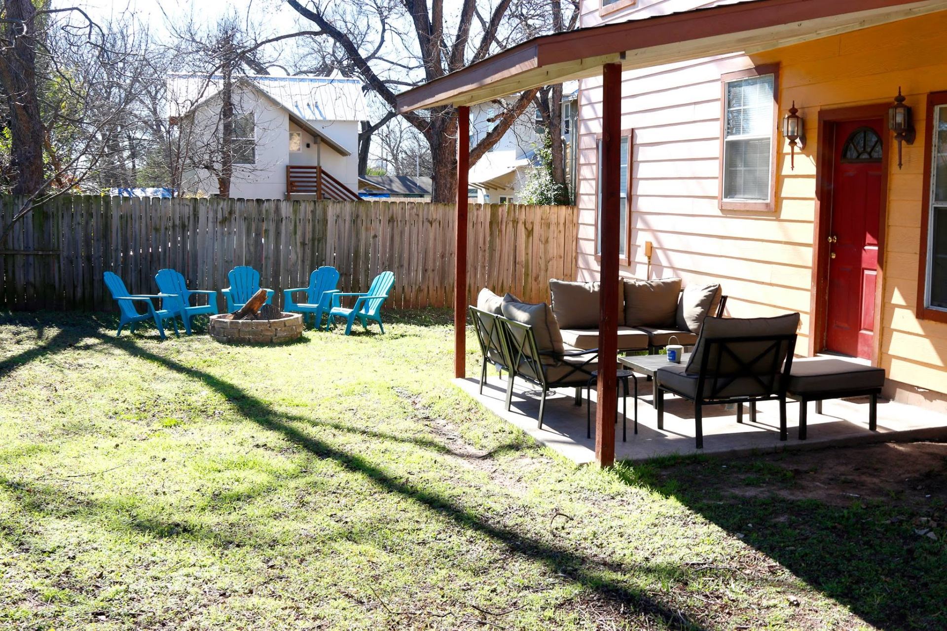 Backyard with covered patio and fire pit